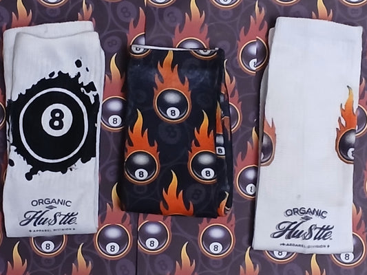 Three pairs of socks with 'Organic Hustle' branding on a fiery background