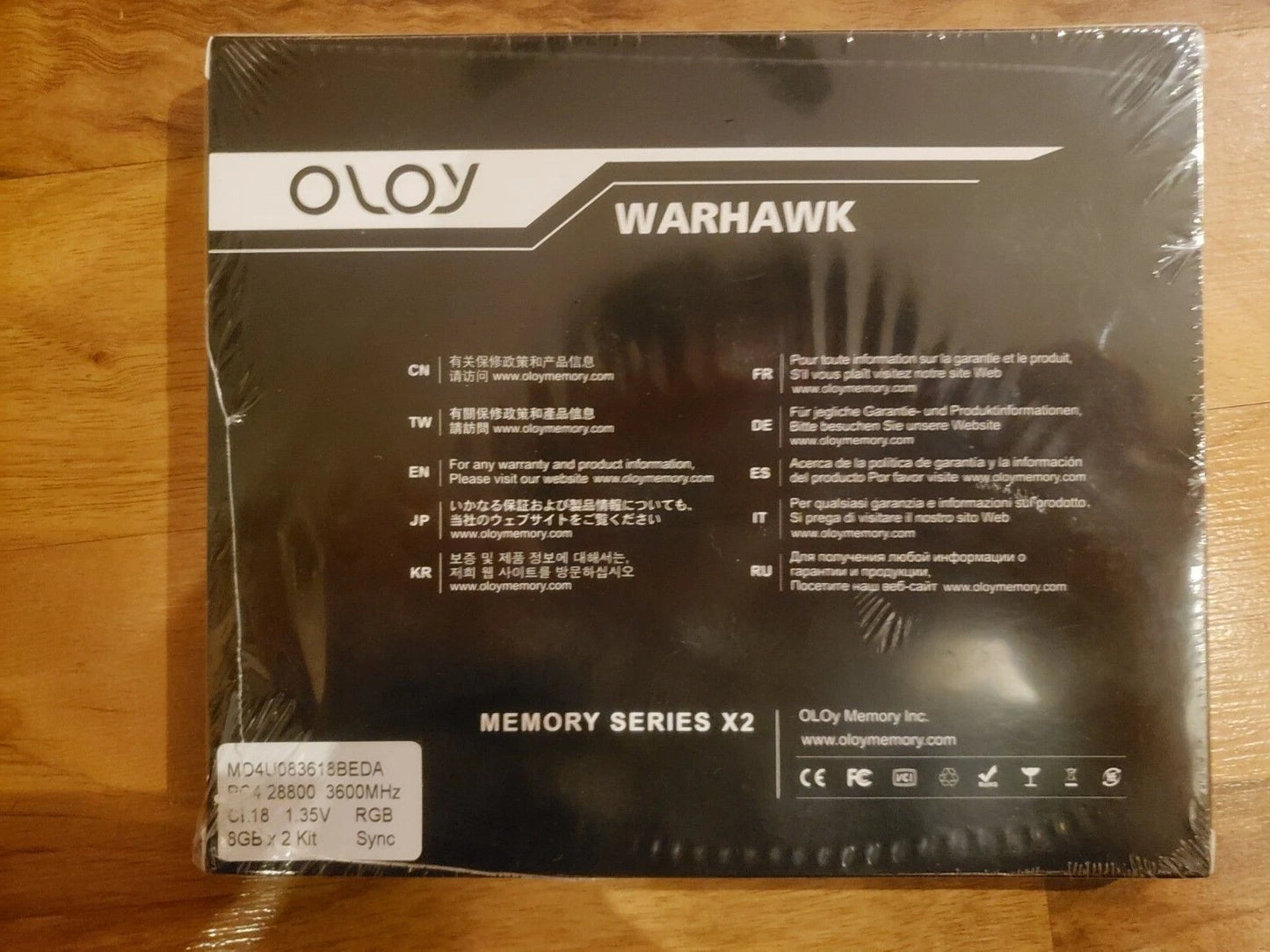 OLOY Warhawk memory series X2 packaging on a wooden surface