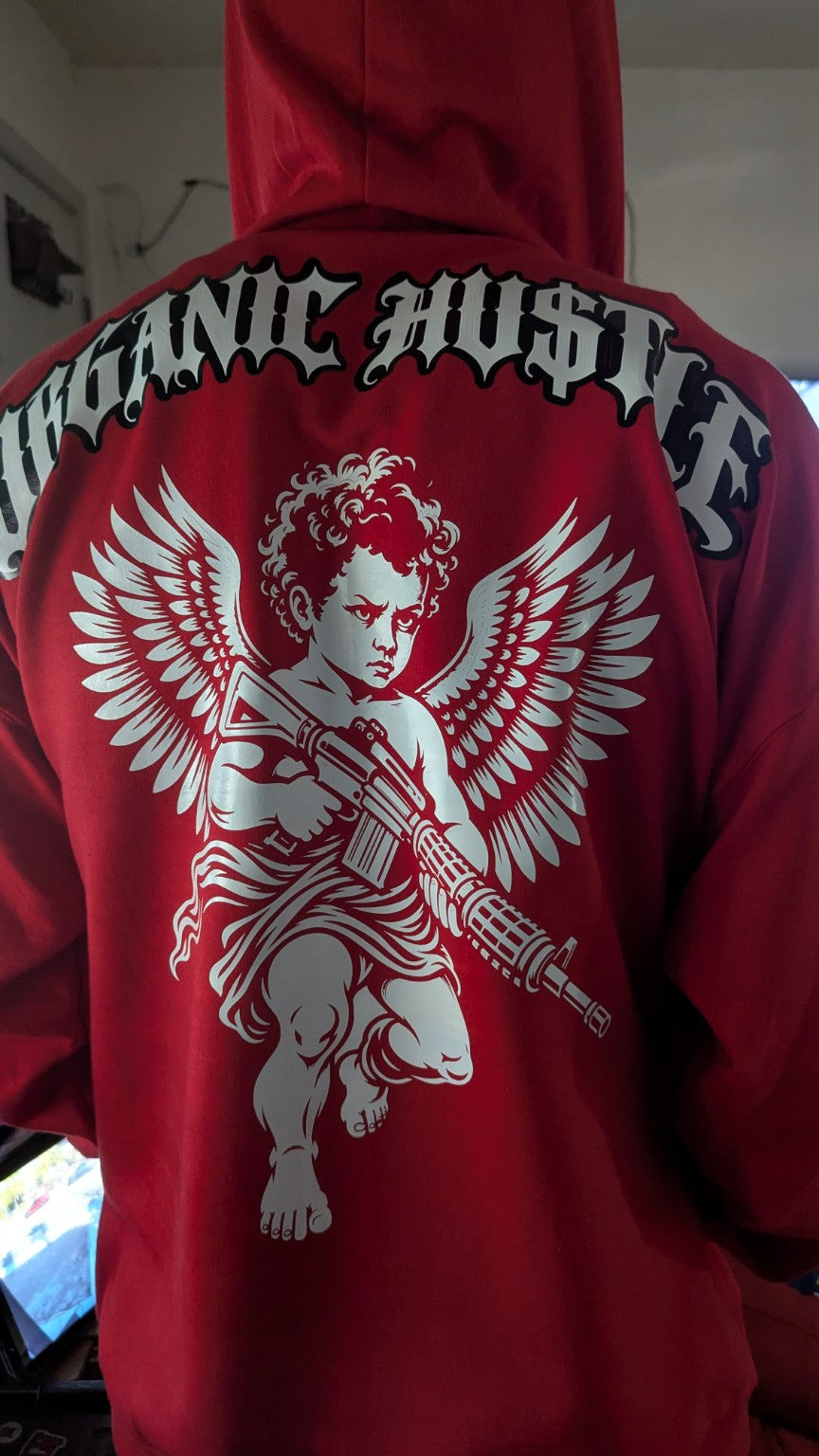 Actual red Organic Hu$tle Guardian Angel zip-up hoodie showing the white angel back artwork