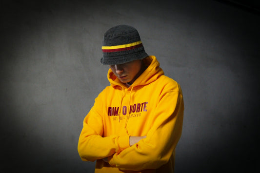 man in yellow and gray hoodie