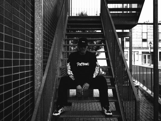 A man sitting on a set of stairs