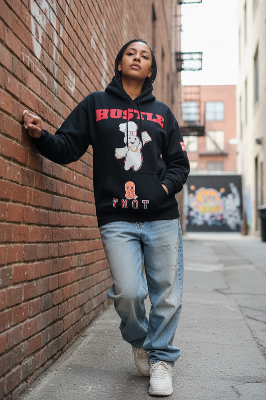 Woman leaning against a brick wall wearing AMERIMADE Jack of All Trades hoodie