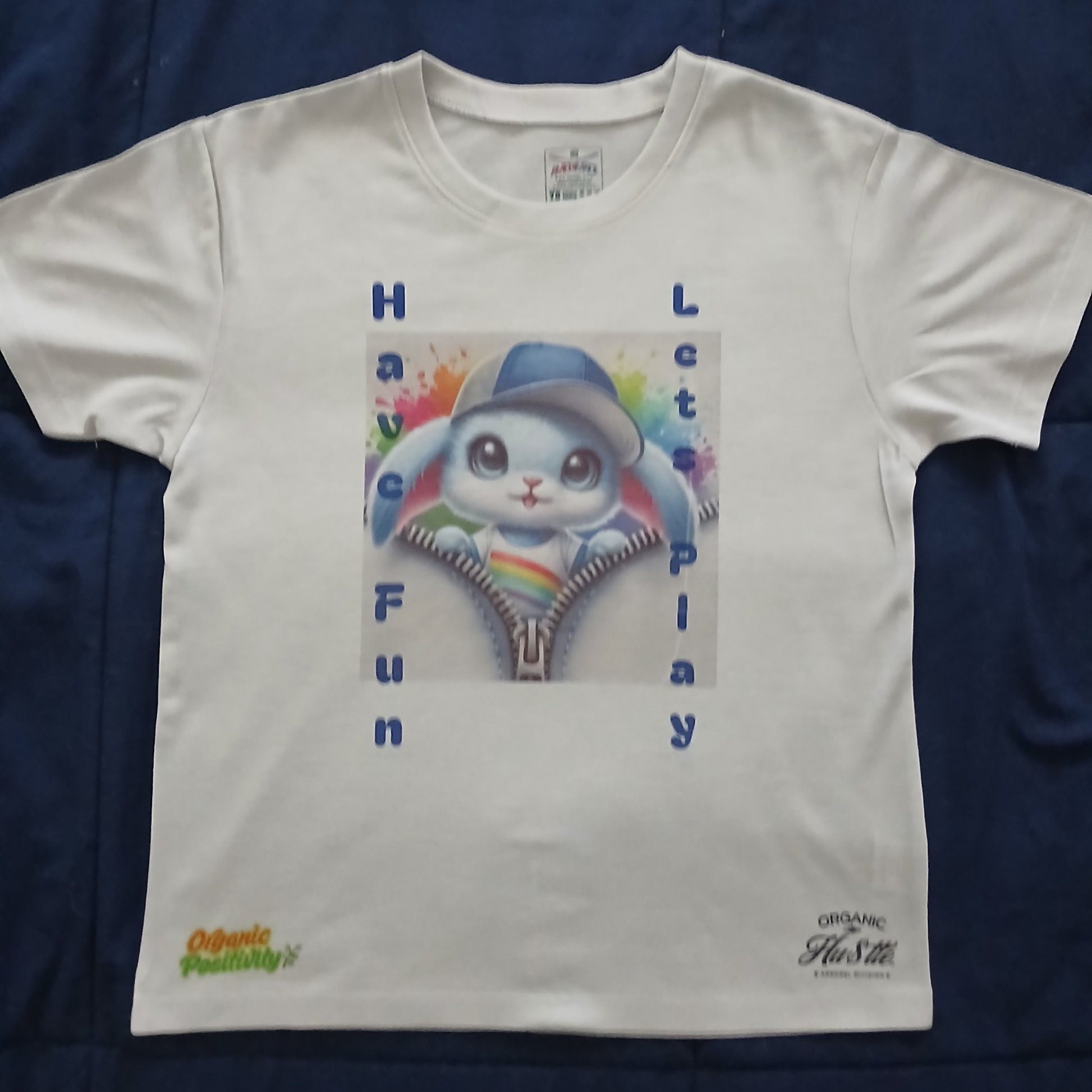 White t-shirt with a cartoon character and text on a blue background