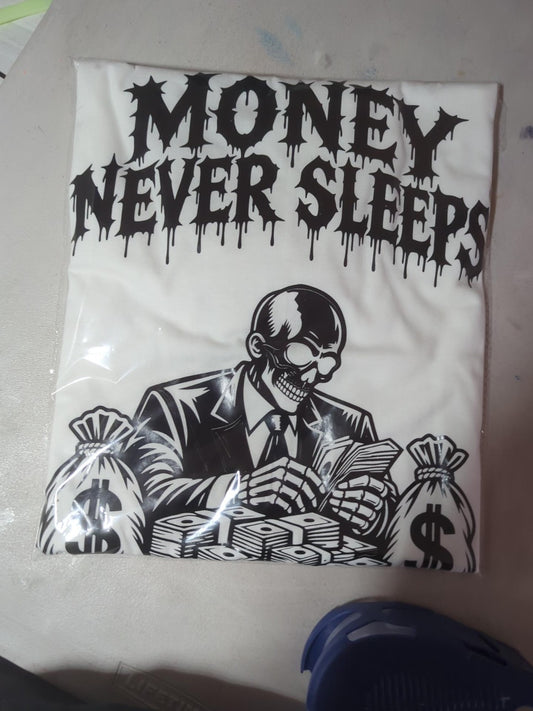 Actual packaged white Money Never Sleeps graphic tee with skull and money artwork