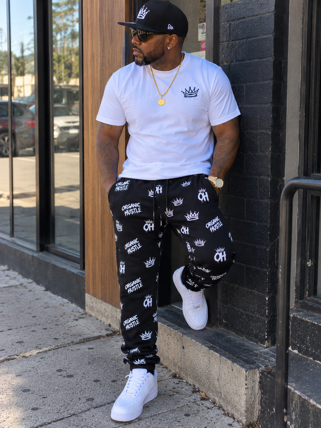 AI-generated lifestyle image: model wearing black Organic Hu$tle sweatpants