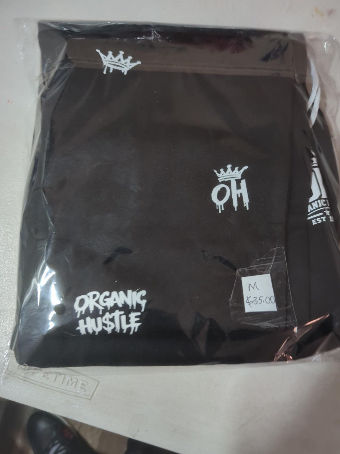 Actual packaged black Organic Hu$tle sweatpants size M