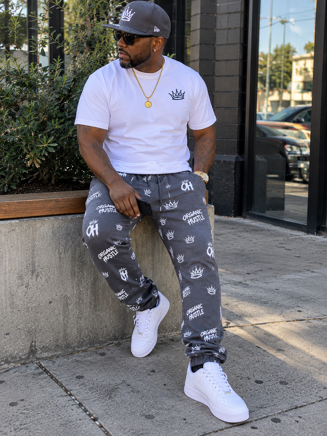 AI-generated lifestyle image: model wearing charcoal gray Organic Hu$tle sweatpants