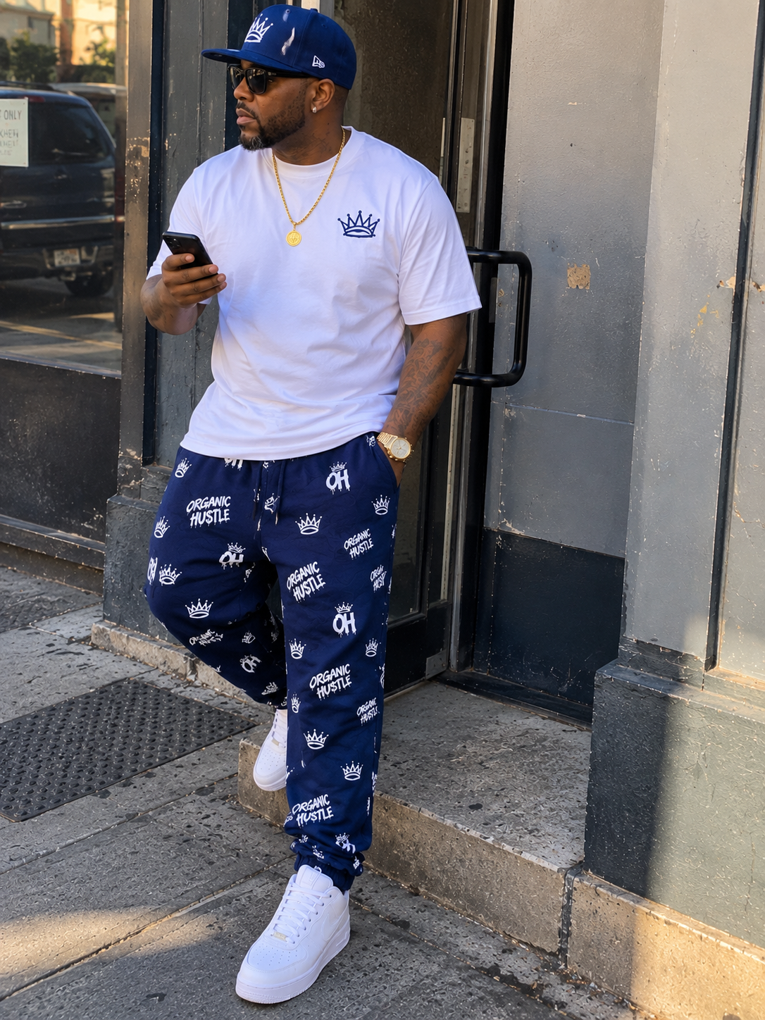 AI-generated lifestyle image: model wearing navy blue Organic Hu$tle sweatpants