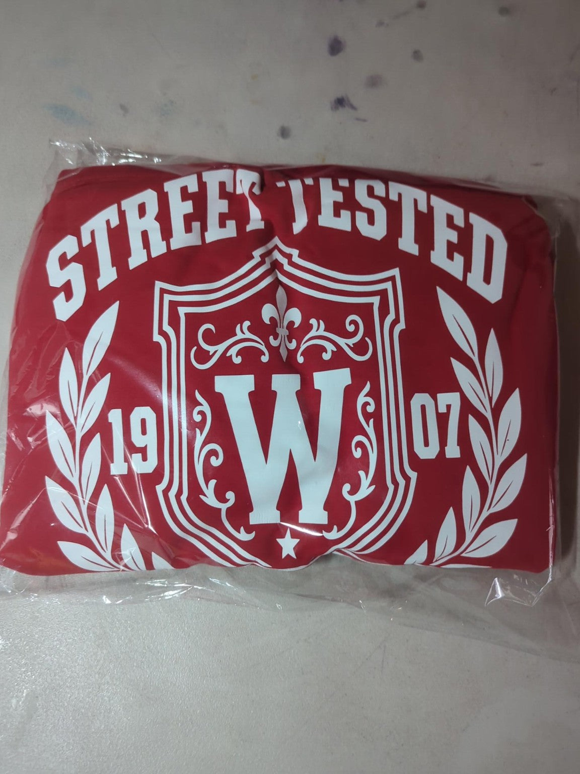 Actual packaged Watts 1907 New Edition red hoodie